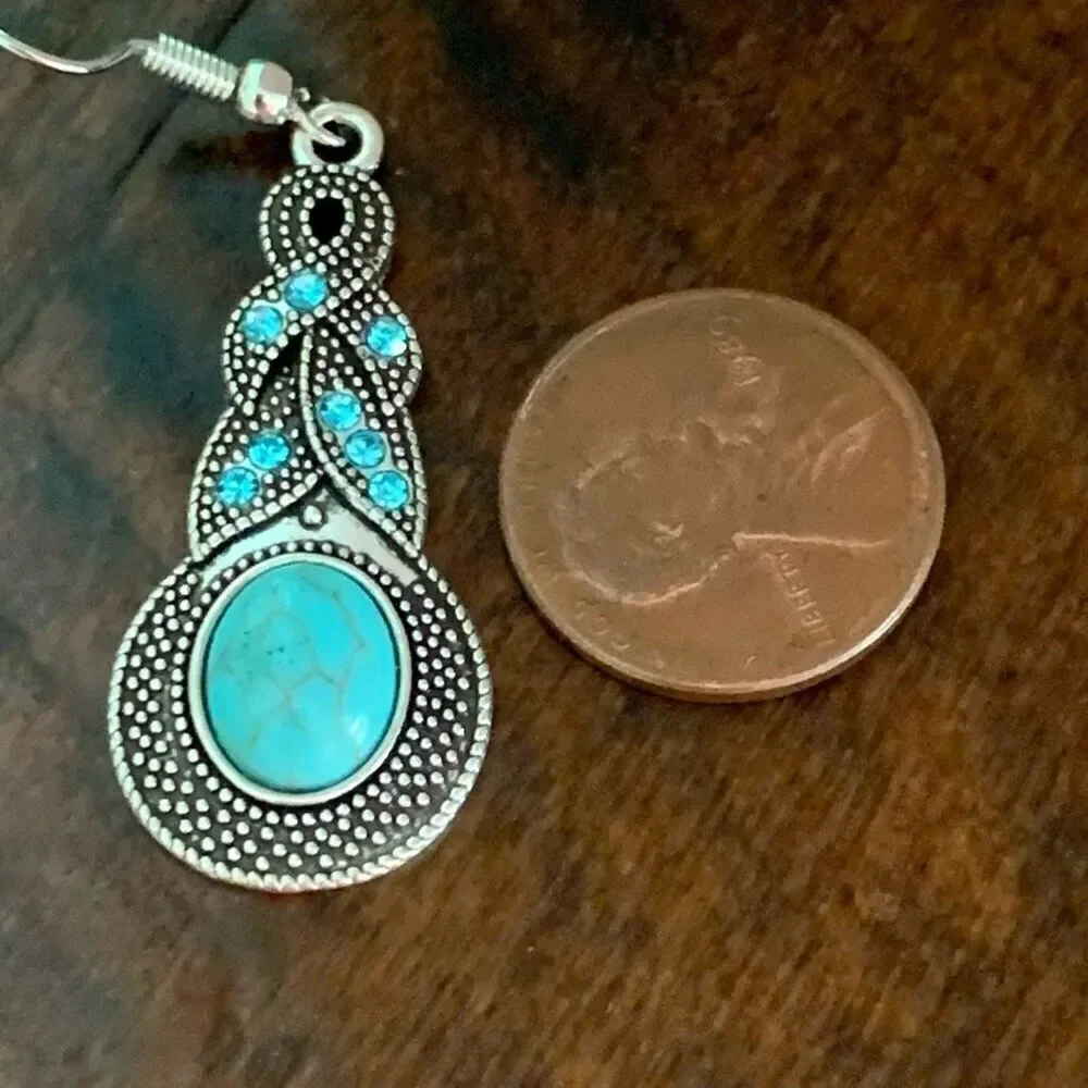 The Mavi Turquoise Blue Dangle Earrings in Silver Tone